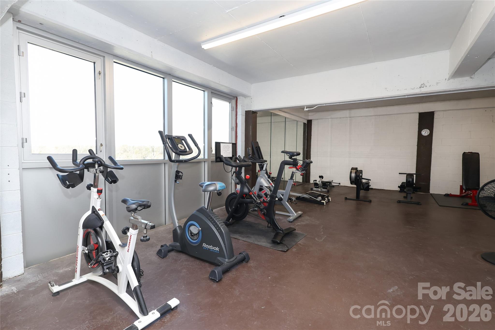 1300 Reece Road, Unit 300 Charlotte, NC 28209 - Photo 19 of 23 a view of a room with gym equipment