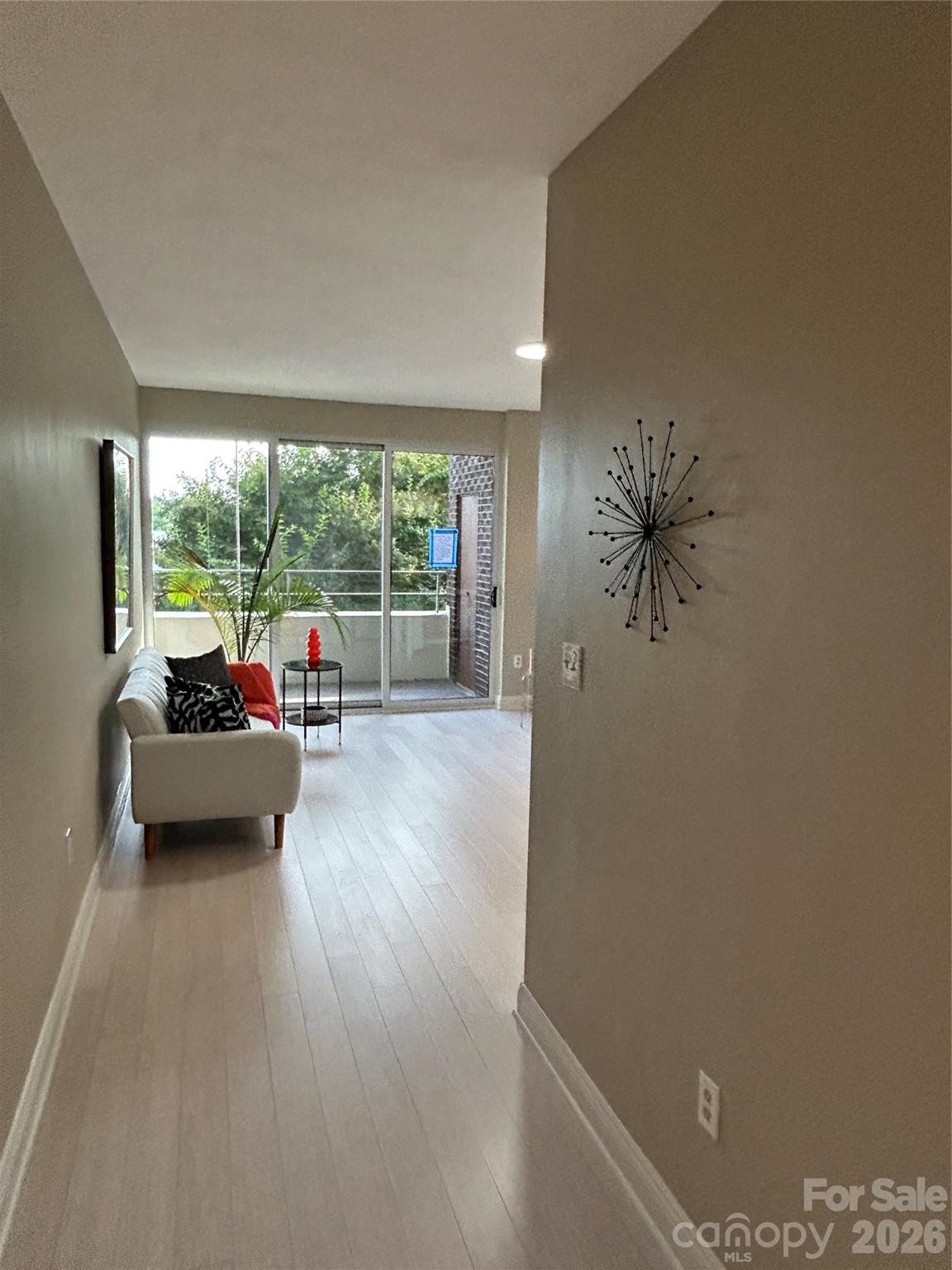 1300 Reece Road, Unit 300 Charlotte, NC 28209 - Photo 5 of 23 a living room with furniture and a large window