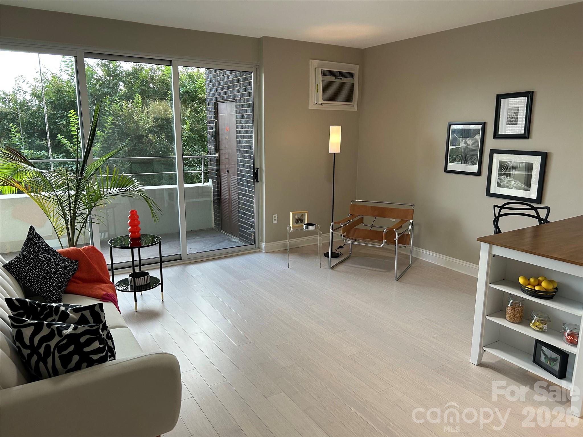 1300 Reece Road, Unit 300 Charlotte, NC 28209 - Photo 6 of 23 a living room with furniture and a window