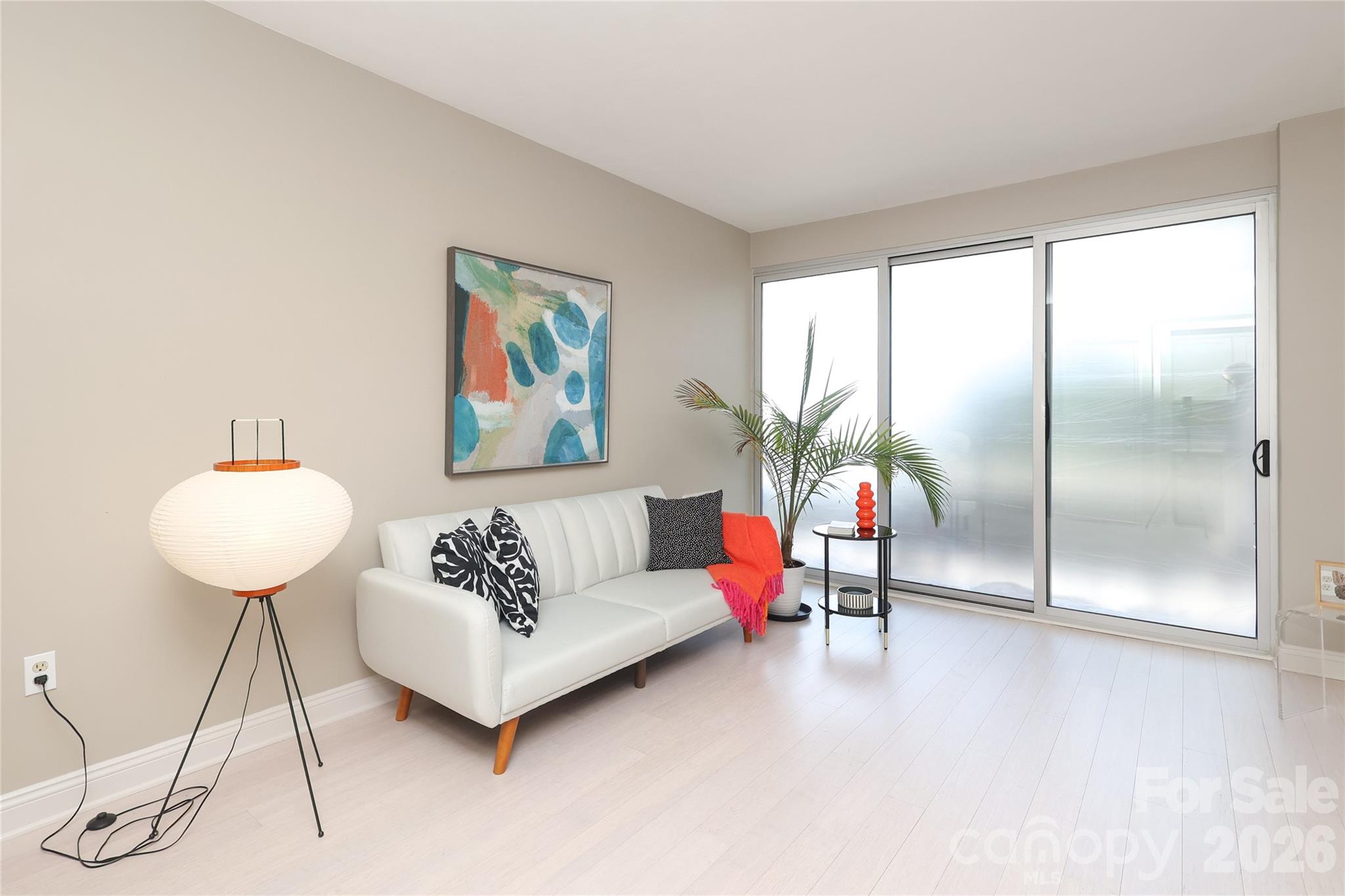 1300 Reece Road, Unit 300 Charlotte, NC 28209 - Photo 7 of 23 a living room with furniture and a potted plant