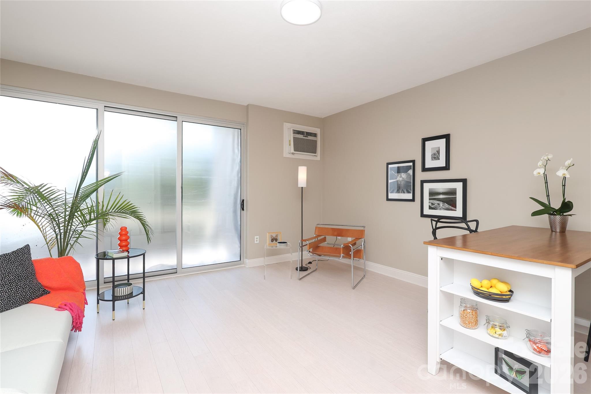 1300 Reece Road, Unit 300 Charlotte, NC 28209 - Photo 8 of 23 a living room with furniture and a table