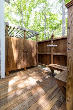 a backyard of a house with a table and chairs