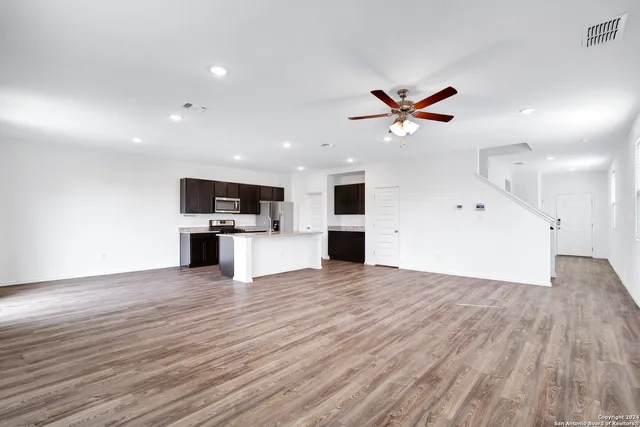 a view of kitchen with cabinets and wooden floor