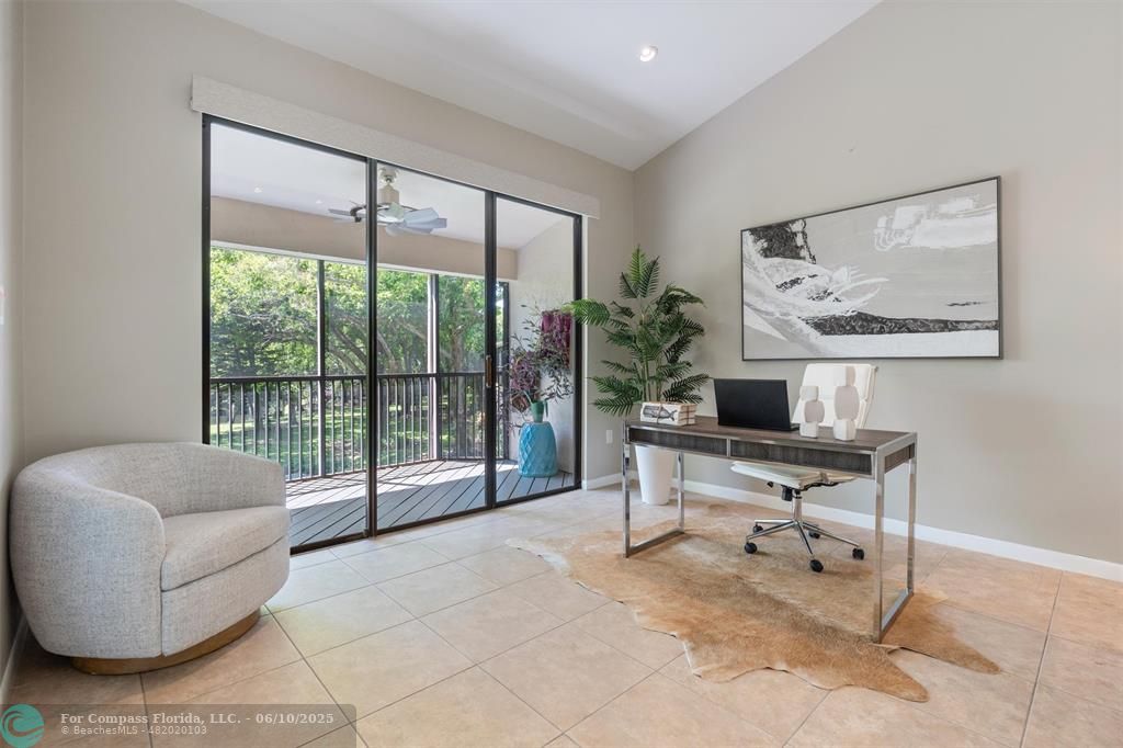 9804 Northwest 1st Court, Unit 9804 Plantation, FL 33324 - Photo 14 of 25 a living room with furniture and a large window