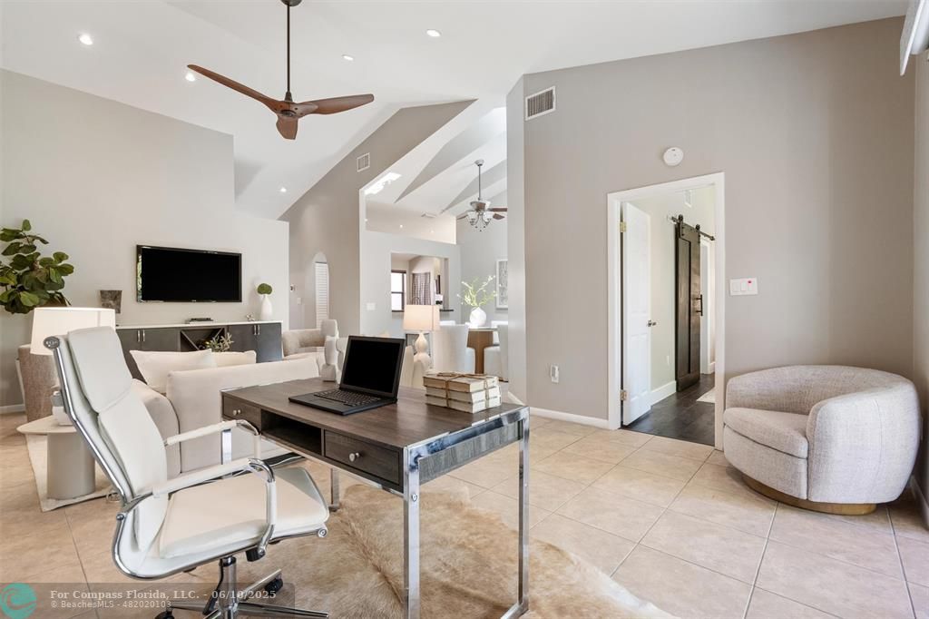 9804 Northwest 1st Court, Unit 9804 Plantation, FL 33324 - Photo 15 of 25 a living room with furniture and a flat screen tv