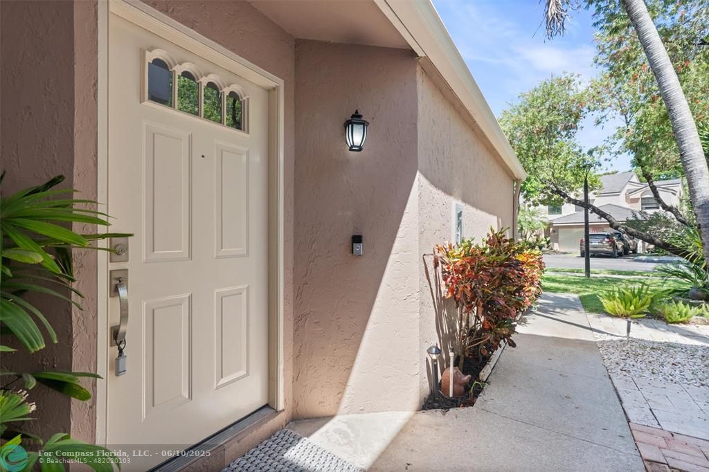 9804 Northwest 1st Court, Unit 9804 Plantation, FL 33324 - Photo 24 of 25 a very nice looking room with a porch
