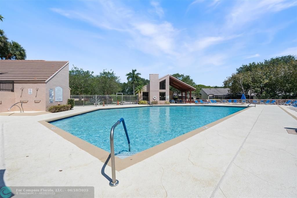 9804 Northwest 1st Court, Unit 9804 Plantation, FL 33324 - Photo 25 of 25 a view of swimming pool with a yard