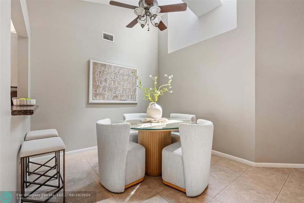 9804 Northwest 1st Court, Unit 9804 Plantation, FL 33324 - Photo 7 of 25 a dining room with furniture and chandelier