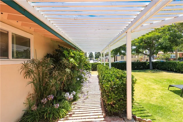 a front view of a house with a sitting area