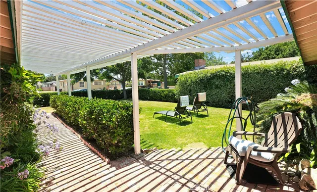 a view of a chair and table on the patio