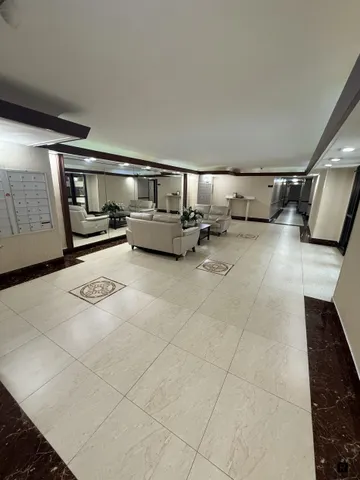 a living room with furniture and night lamp