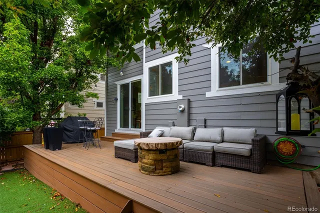 a view of a patio with couches chairs and a potted plant
