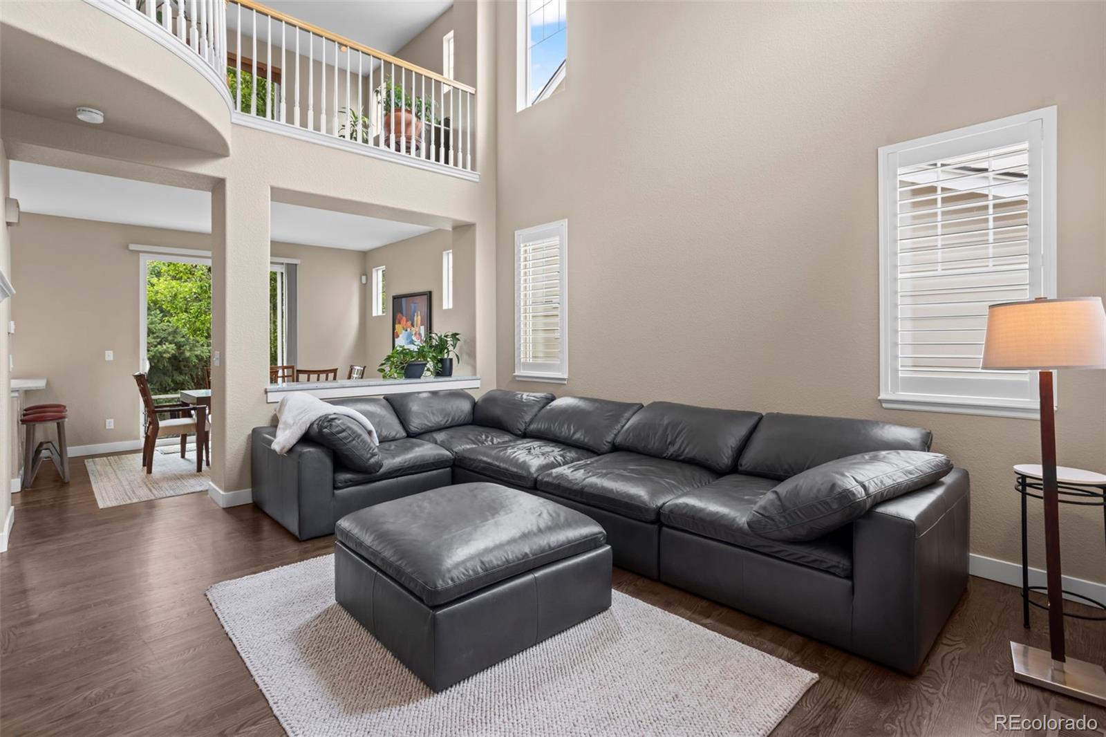 10704 Riverbrook Circle Highlands Ranch, CO 80126 - Photo 14 of 40 a living room with furniture and a window