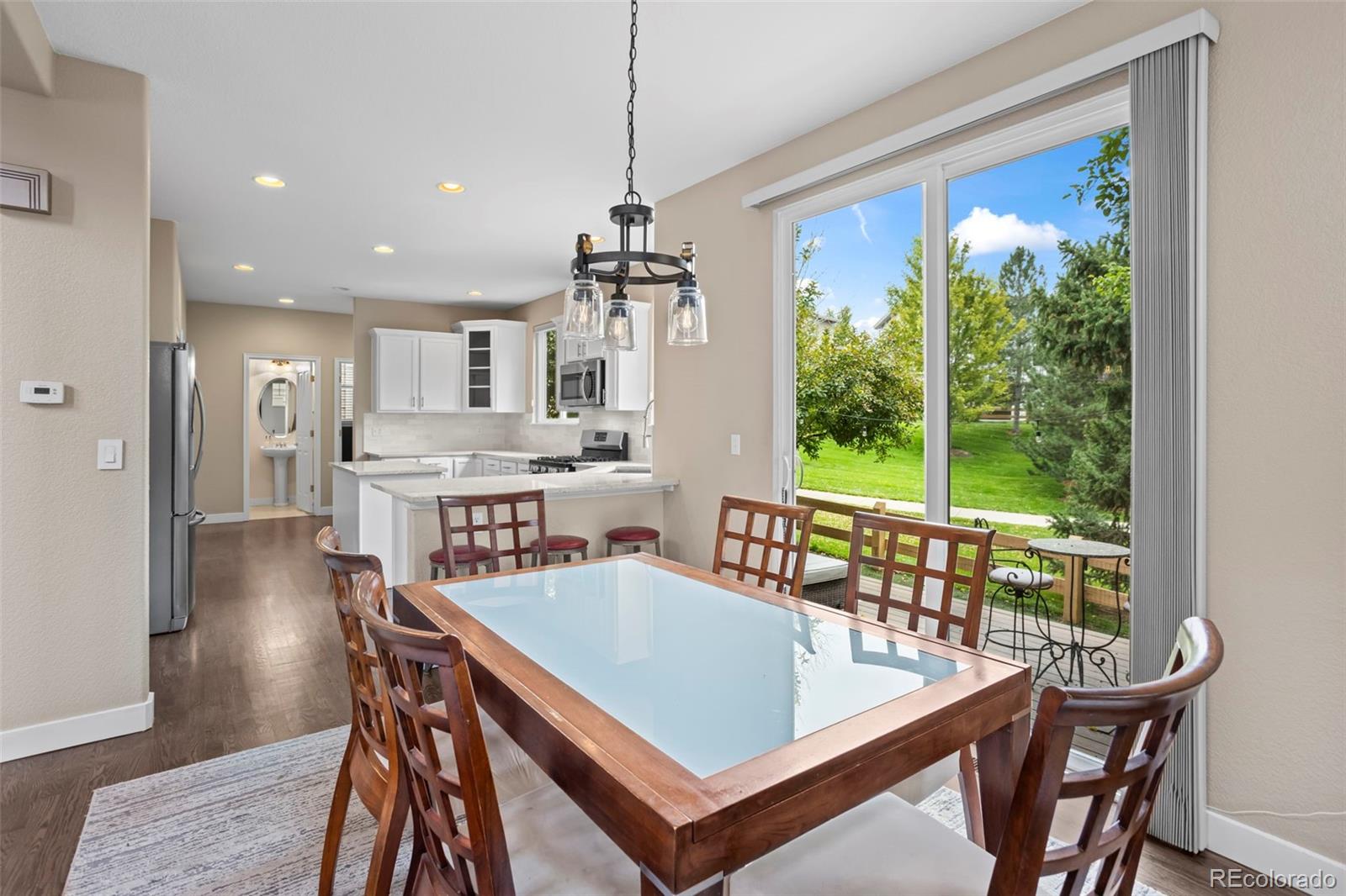 10704 Riverbrook Circle Highlands Ranch, CO 80126 - Photo 17 of 40 a view of a dining room with furniture window and outside view