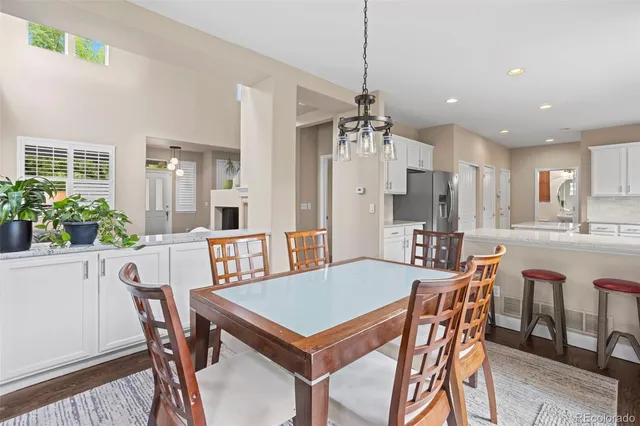a view of a dining room and livingroom view kitchen with a table and chairs
