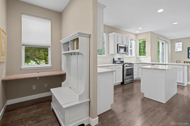 a kitchen with a sink stove and refrigerator