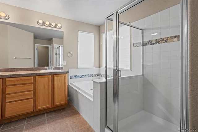 a bathroom with a double vanity sink and mirror