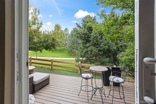 a view of a chairs and table in the balcony