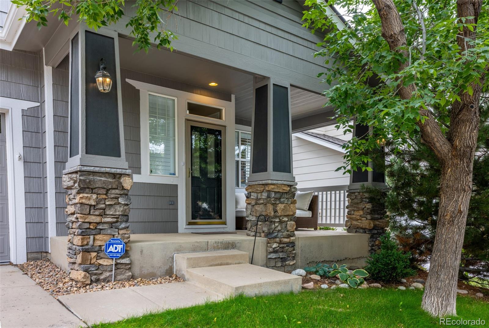 10704 Riverbrook Circle Highlands Ranch, CO 80126 - Photo 4 of 40 front view of house with a yard