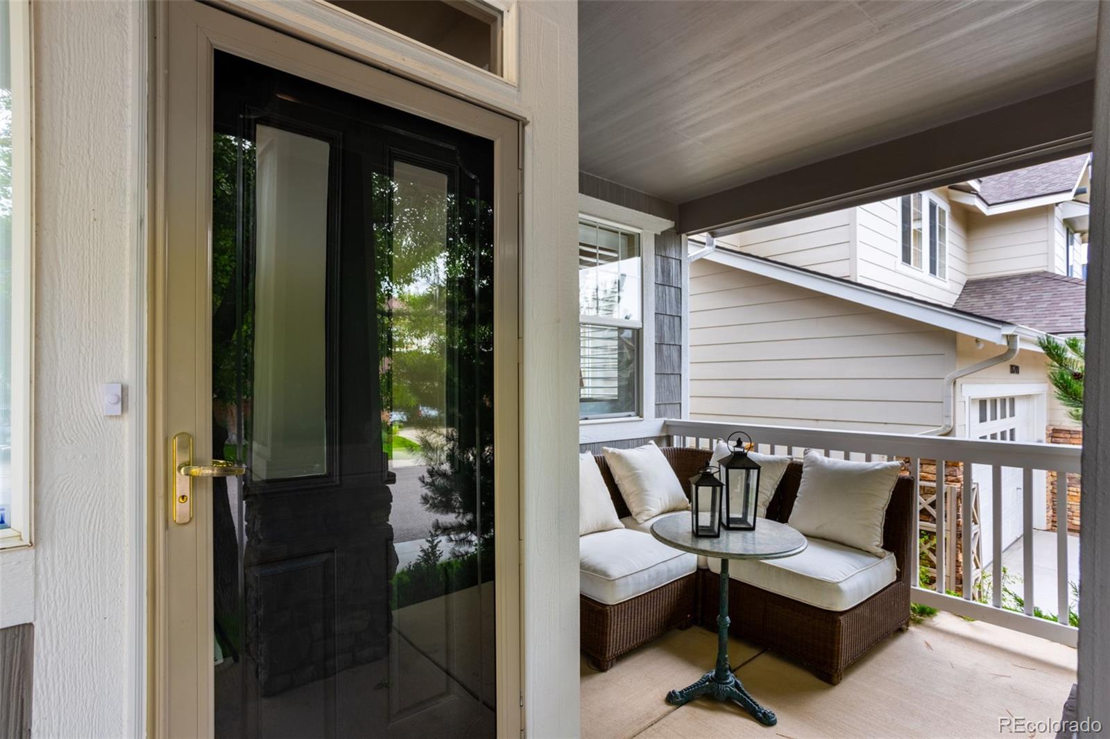 10704 Riverbrook Circle Highlands Ranch, CO 80126 - Photo 5 of 40 a balcony with furniture and a potted plant