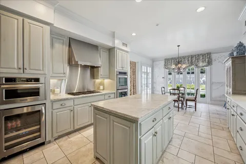 a kitchen with a stove a sink and a refrigerator