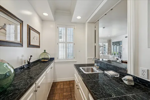 a kitchen with sink and window