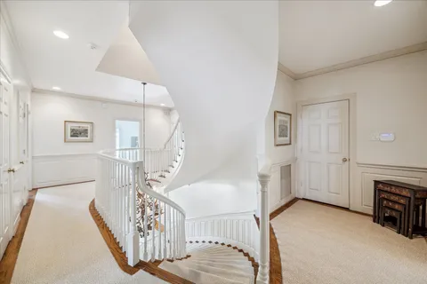 a view of a livingroom with furniture and staircase