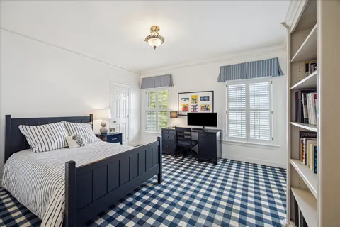 a bedroom with a bed and a dresser