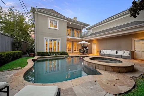 a view of a patio with table and chairs and potted plants