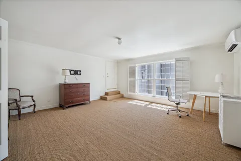 a view of workspace with furniture and window