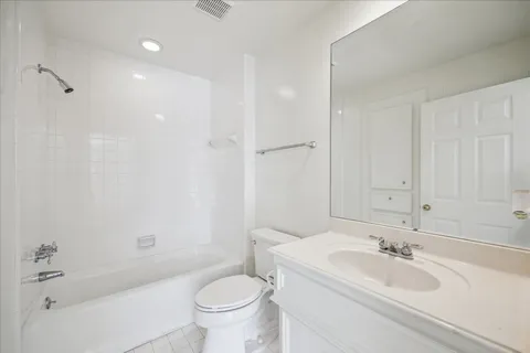 a bathroom with a bathtub and a toilet