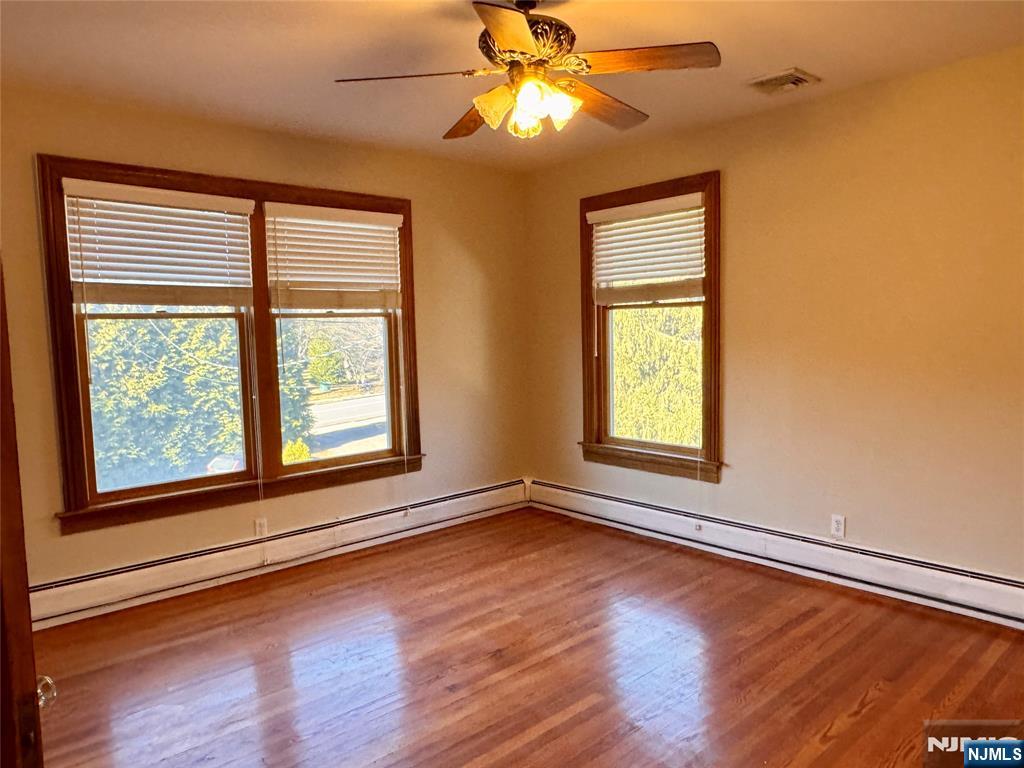 232 Franklin Turnpike Allendale, NJ 07401 - Photo 18 of 30 a view of an empty room with wooden floor and a window