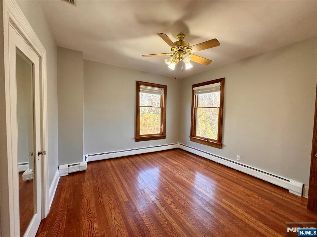 232 Franklin Turnpike Allendale, NJ 07401 - Photo 20 of 30 a view of an empty room with wooden floor and a window