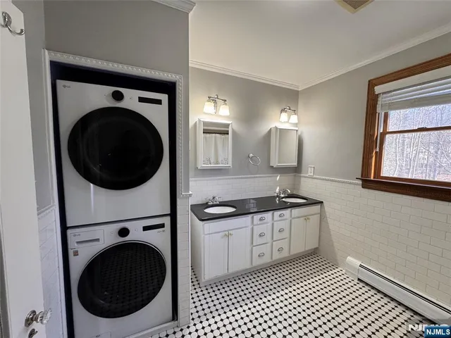 a kitchen with a sink a stove top oven and cabinets