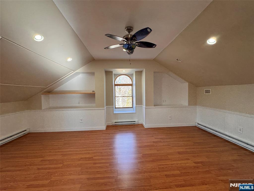 232 Franklin Turnpike Allendale, NJ 07401 - Photo 25 of 30 an empty room with wooden floor fan and windows