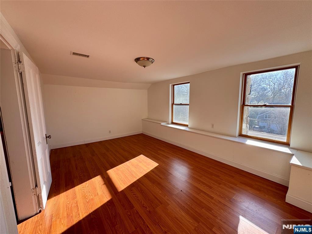 232 Franklin Turnpike Allendale, NJ 07401 - Photo 27 of 30 an empty room with wooden floor and windows