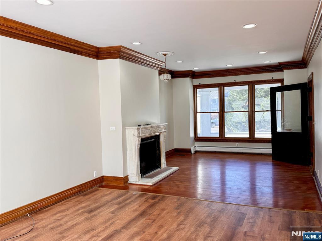 232 Franklin Turnpike Allendale, NJ 07401 - Photo 4 of 30 a view of an empty room with window and wooden floor