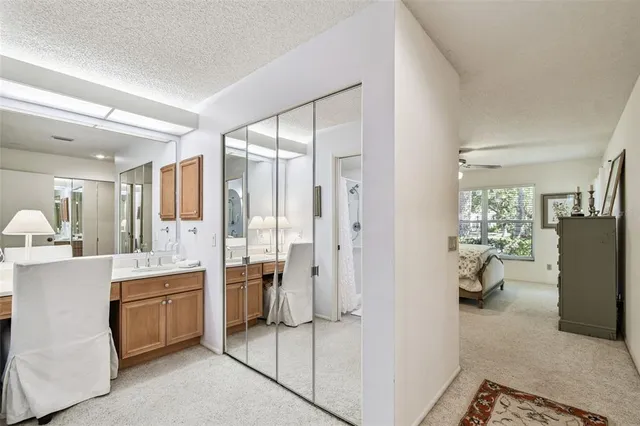 a room with a bed and a view of walk in closet