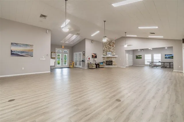 a kitchen with lots of counter space sink and wooden floor