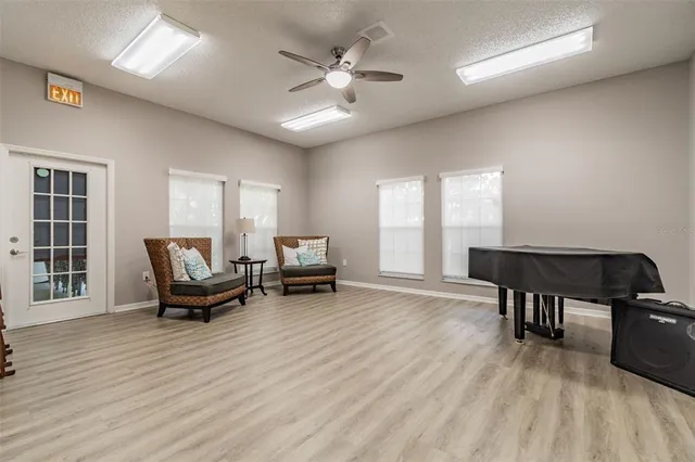 a view of a street with a house in the background