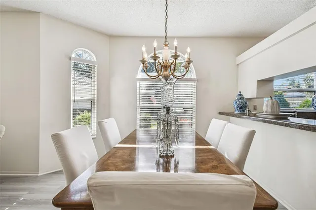 a view of a dining room with furniture window and outside view
