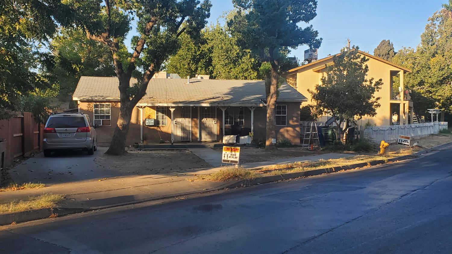 137 Sycamore Street Madera, CA 93638 - Photo 1 of 10 a view of a house with swimming pool and sitting area