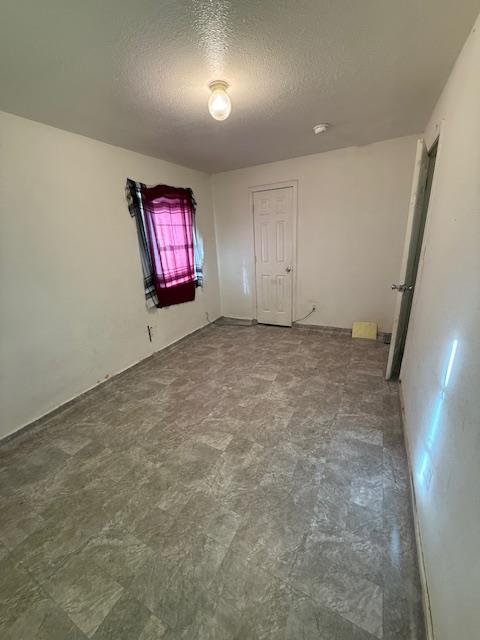 137 Sycamore Street Madera, CA 93638 - Photo 6 of 10 an empty room with windows