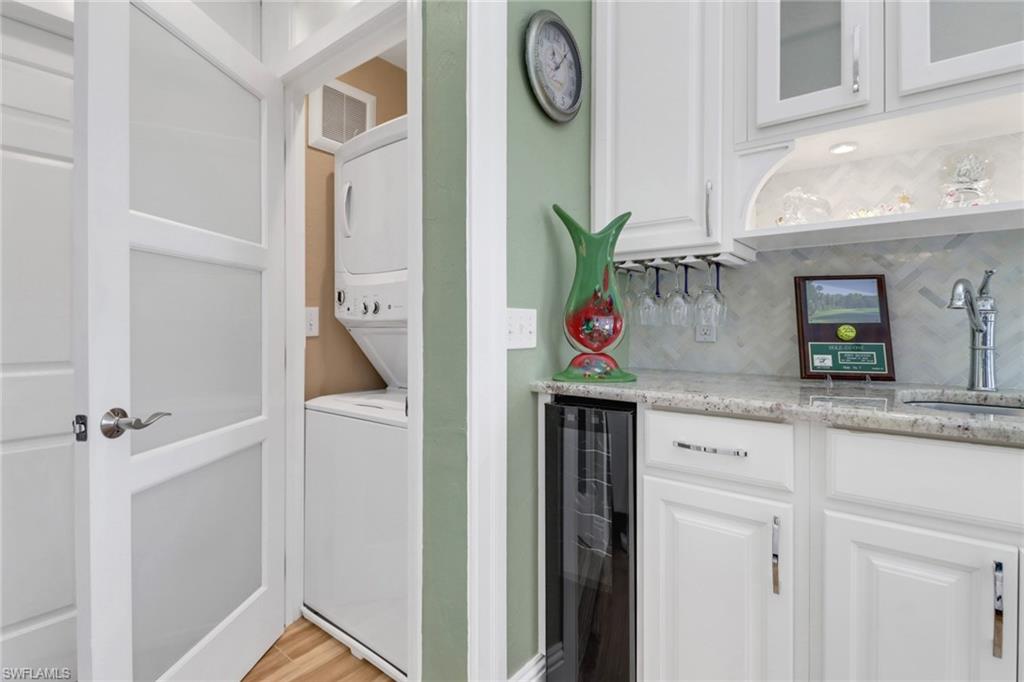 310 Fox Den Circle Naples, FL 34104 - Photo 15 of 46 a bathroom with a granite countertop sink and a mirror