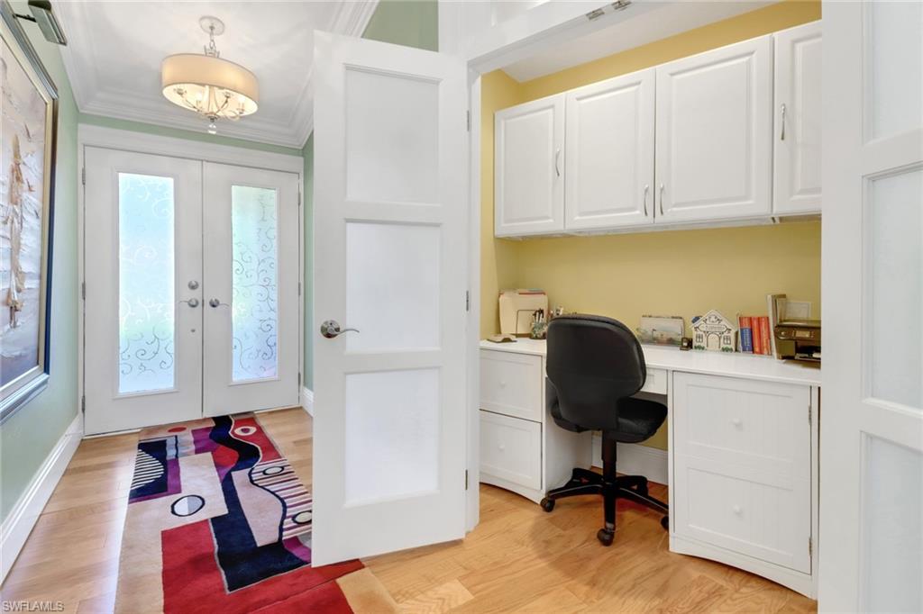310 Fox Den Circle Naples, FL 34104 - Photo 24 of 46 a view of a workspace with furniture and a window