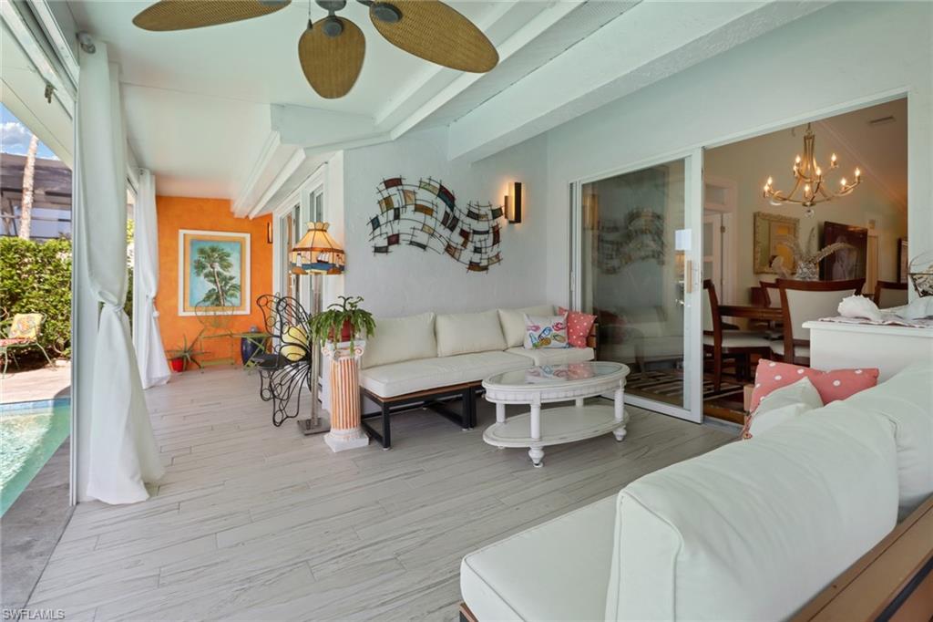 310 Fox Den Circle Naples, FL 34104 - Photo 25 of 46 a living room with furniture and wooden floor