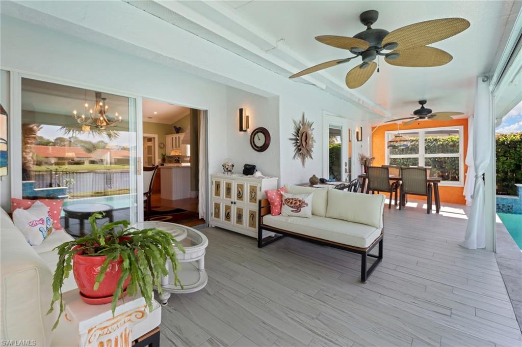 310 Fox Den Circle Naples, FL 34104 - Photo 26 of 46 a living room with furniture and wooden floor