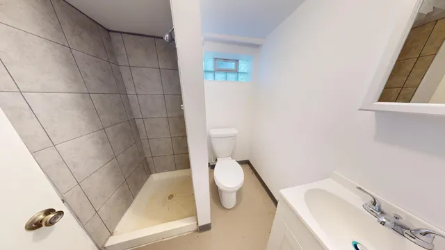 a bathroom with a toilet and a sink