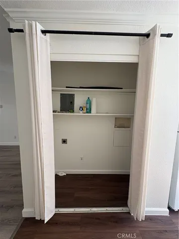 a kitchen with wooden floors and appliances