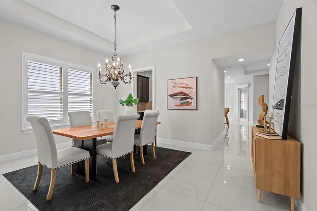 a view of a dining room with furniture and window